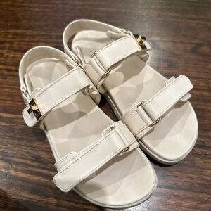 Stylish White Sandals with Gold Accents
